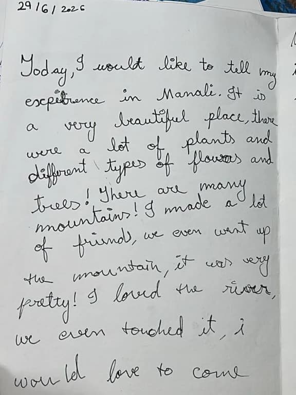 A page of a notebook in looping cursive, dated 29/6/2026, describing a trip to Manali — the plants, the mountains, the friends made and the river.